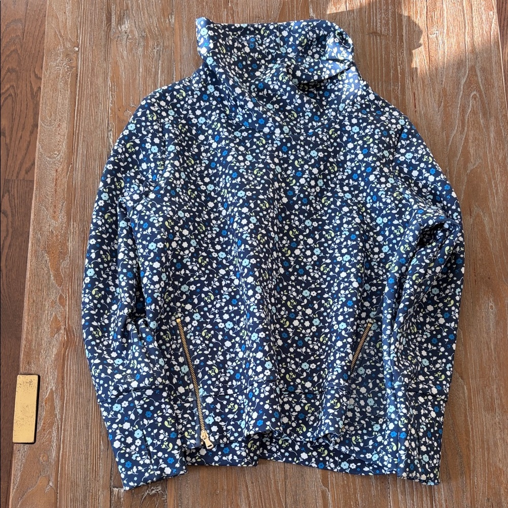 Addison Bay size medium.Floral Navy Funnel Neck Pullover with Zipper details.